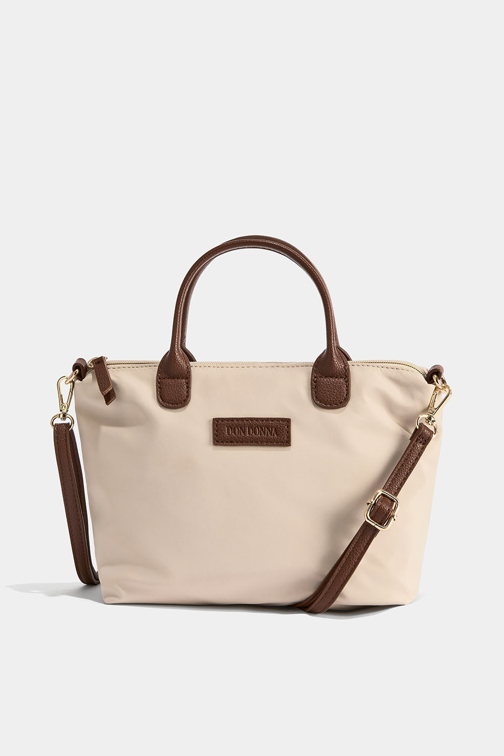 Beige käsilaukku crossbody-hihnalla
