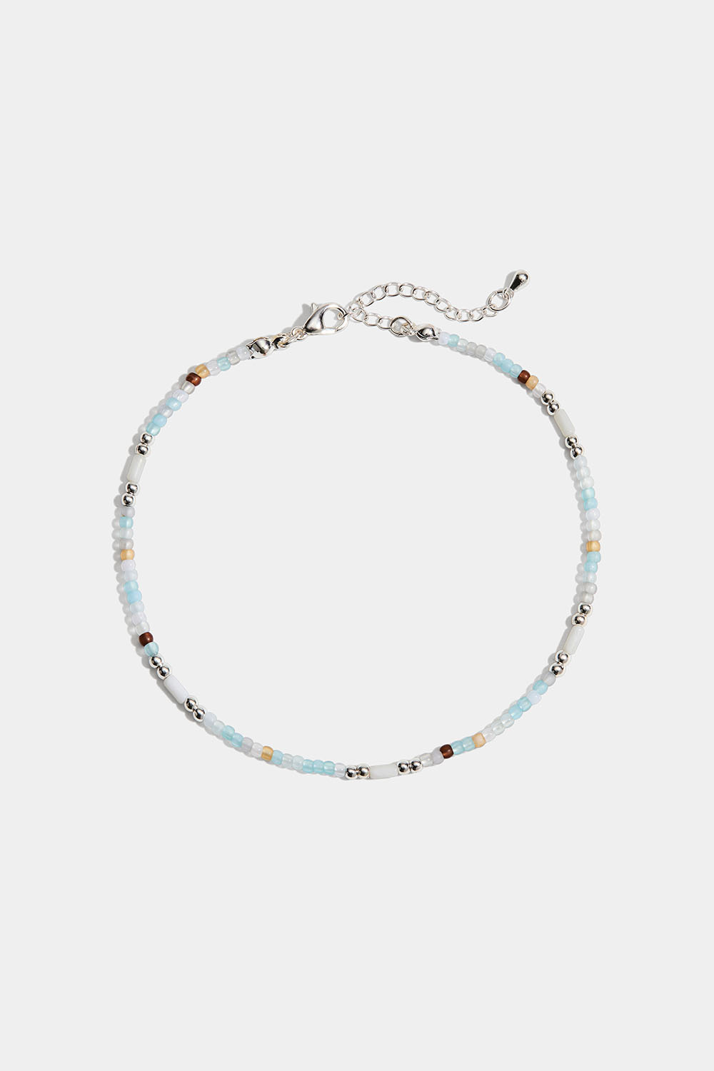 Vaaleansävyinen nilkkakoru