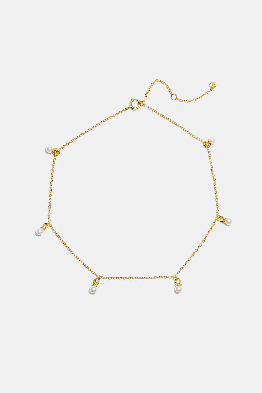 Nilkkakoru helmillä, 18 karaatin kultaus